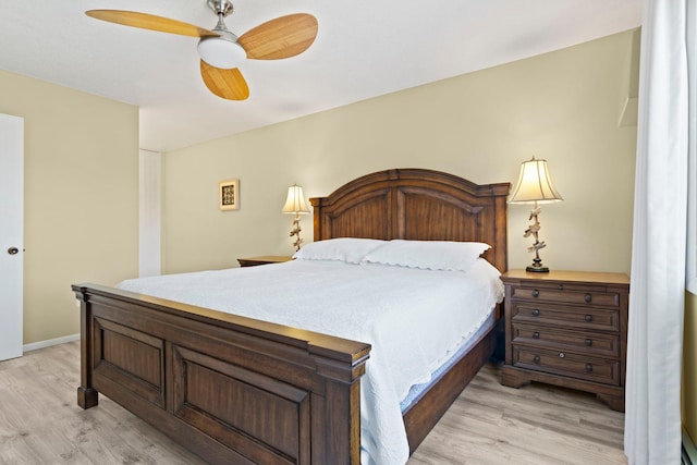 bedroom with light wood-type flooring and ceiling fan