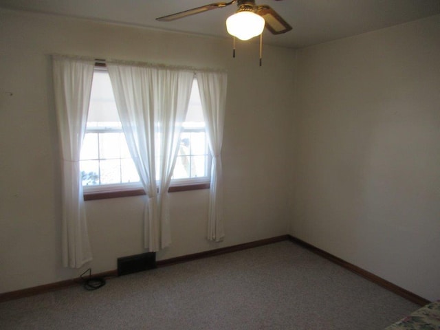 unfurnished room featuring ceiling fan