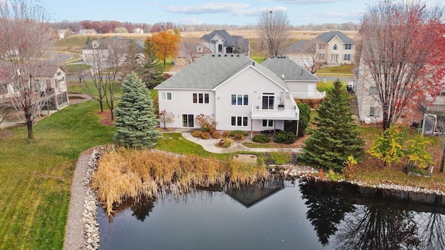 birds eye view of property with a water view