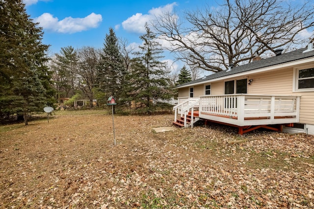 view of yard featuring a wooden deck