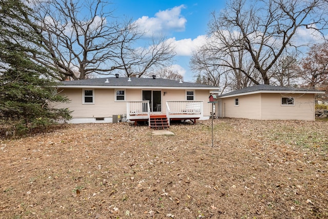 rear view of property featuring a wooden deck and central AC