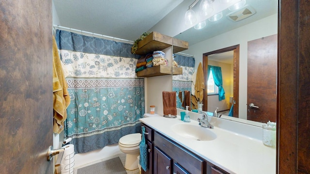 bathroom with toilet and vanity