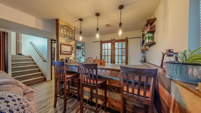 interior space with hardwood / wood-style floors and a barn door