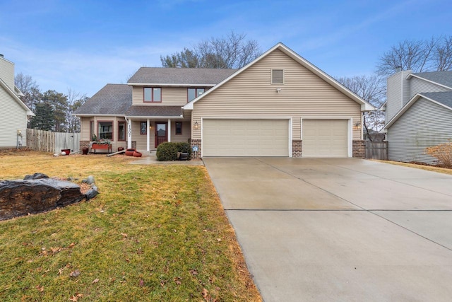 traditional-style home featuring an attached garage, covered porch, fence, concrete driveway, and a front lawn