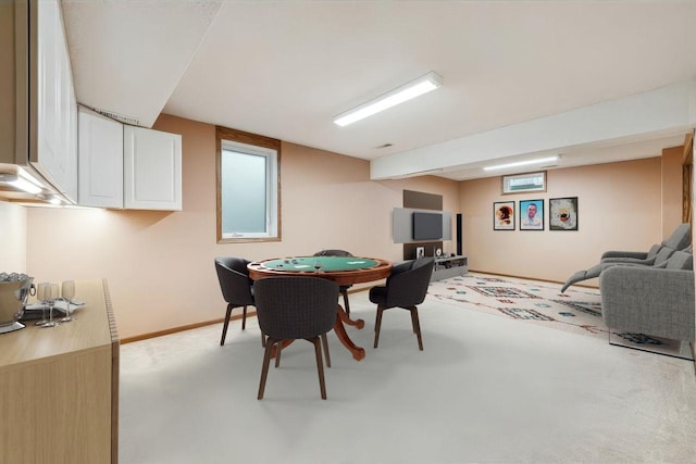 playroom featuring baseboards and light colored carpet