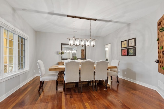 dining space featuring dark hardwood / wood-style flooring