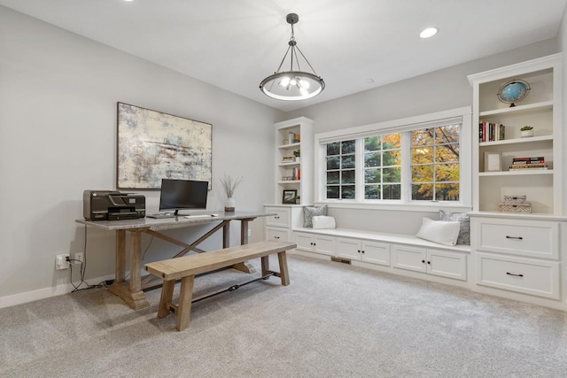 carpeted office space featuring an inviting chandelier