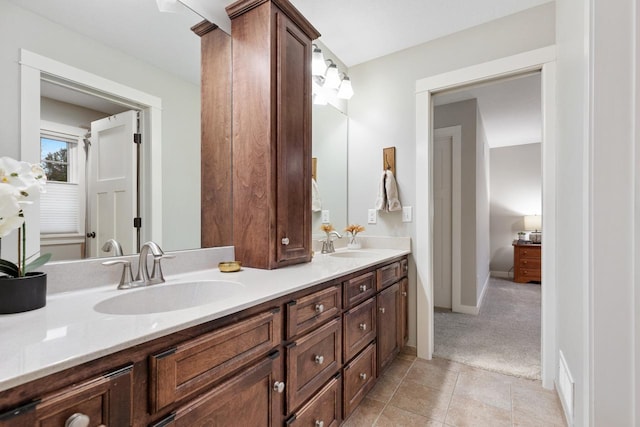 bathroom with tile patterned flooring and vanity