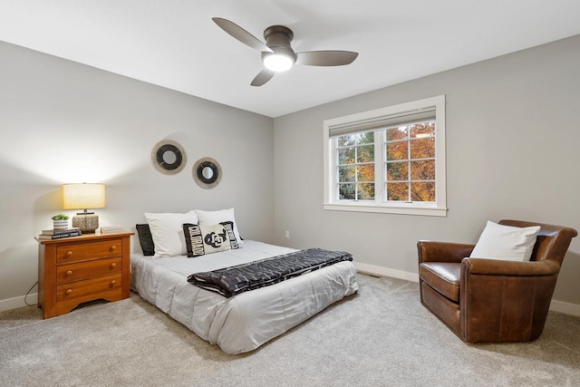 bedroom featuring ceiling fan and light colored carpet