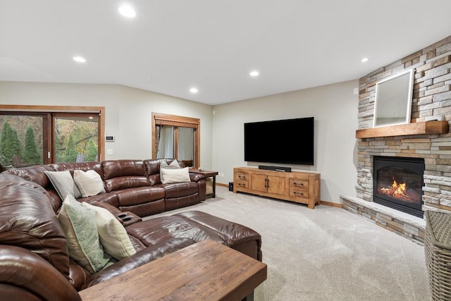 carpeted living room featuring french doors and a fireplace