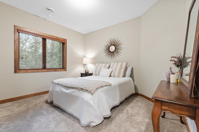 bedroom with light colored carpet