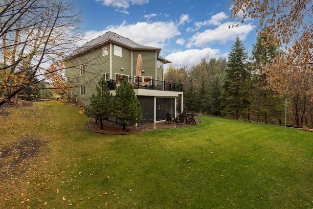 view of yard featuring a deck and a sunroom