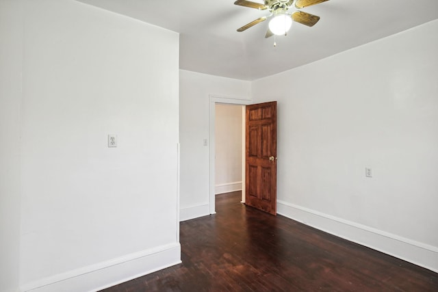 unfurnished room featuring dark hardwood / wood-style floors and ceiling fan