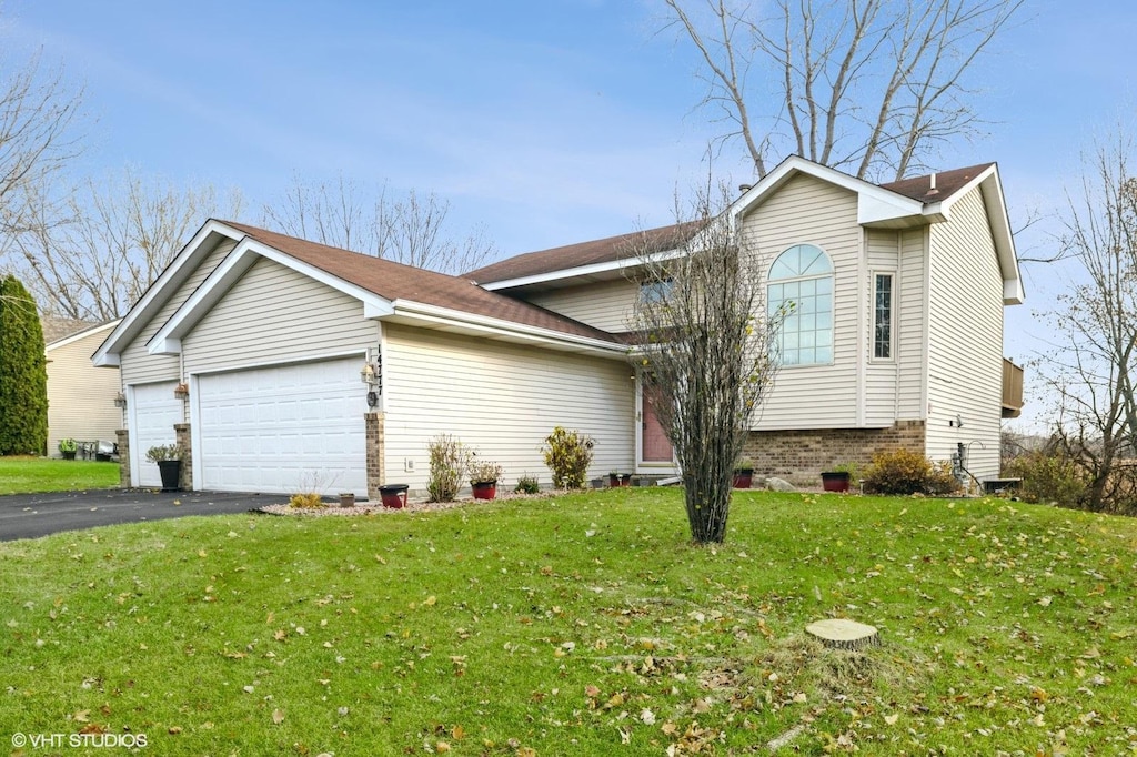 view of front facade with a front lawn and a garage