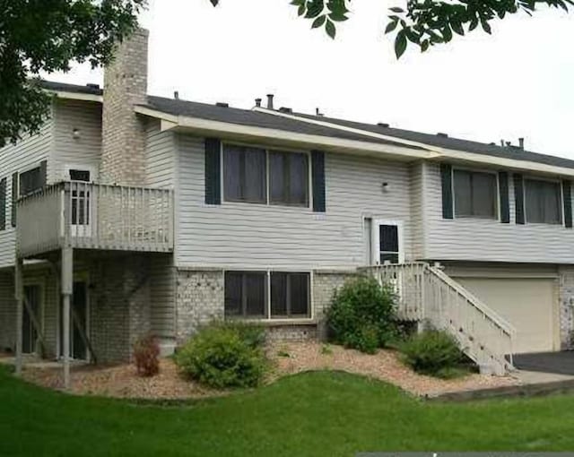 back of house featuring a garage