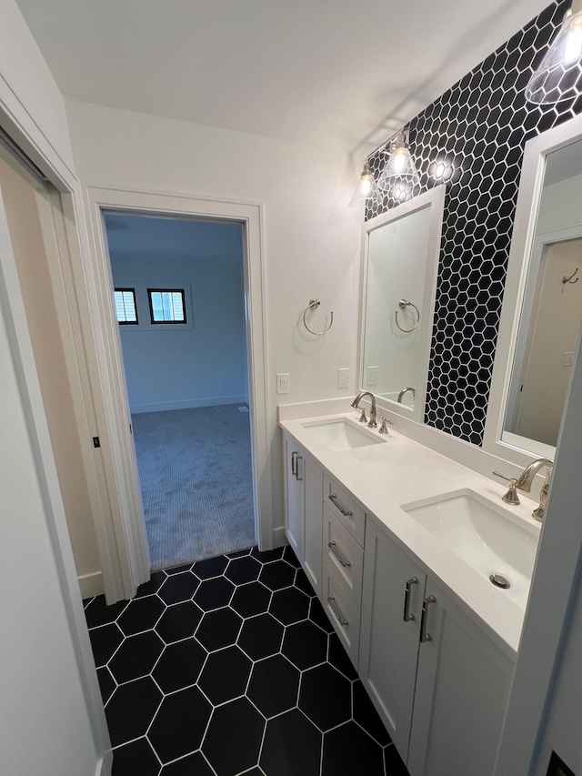 bathroom featuring double vanity and a sink