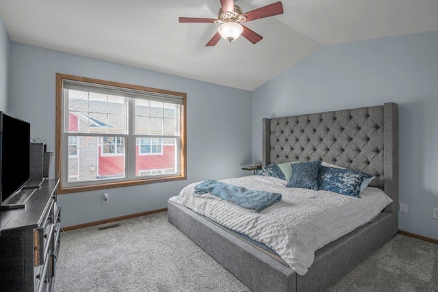 bedroom featuring carpet, vaulted ceiling, and ceiling fan