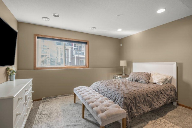 bedroom featuring light colored carpet