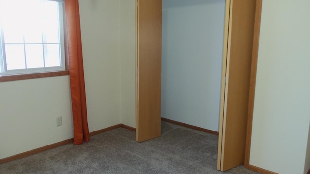 unfurnished bedroom with carpet floors