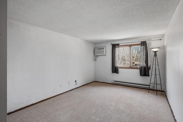 empty room with carpet, an AC wall unit, a textured ceiling, and baseboard heating