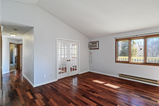 spare room with a baseboard radiator, baseboards, vaulted ceiling, french doors, and wood-type flooring