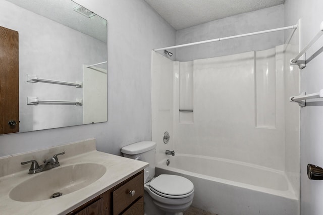 full bathroom with shower / tub combination, a textured ceiling, toilet, and vanity