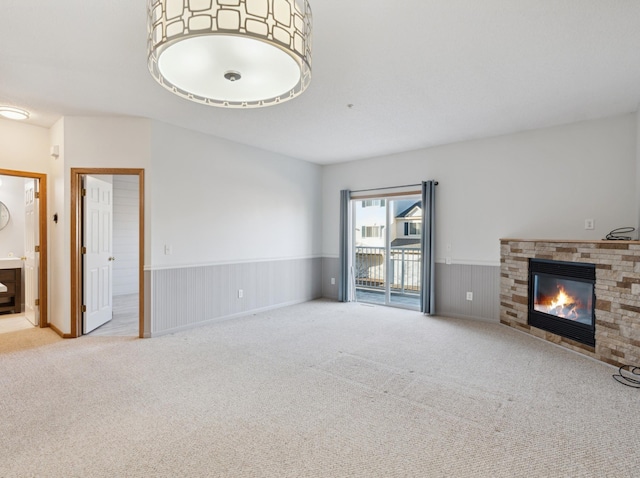 unfurnished living room with light colored carpet