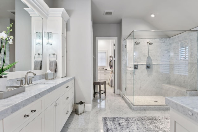 bathroom featuring vanity and walk in shower