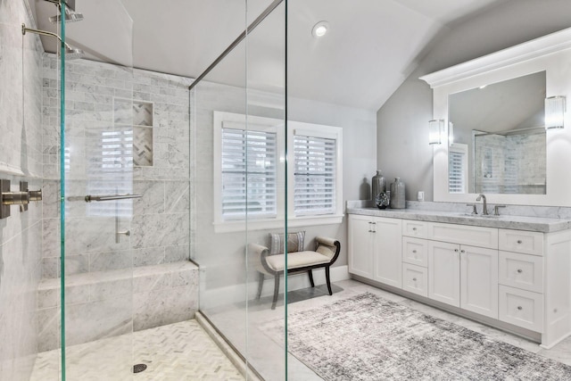 bathroom with tile patterned flooring, vanity, an enclosed shower, and lofted ceiling