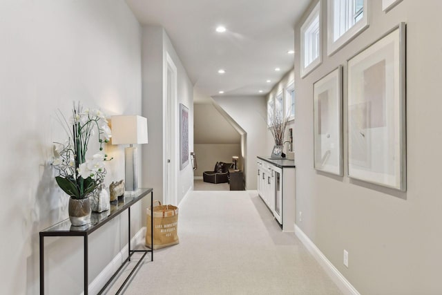 hallway with light carpet