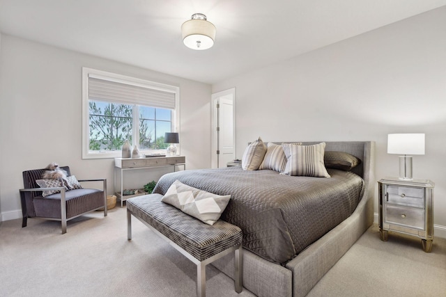 bedroom featuring light carpet