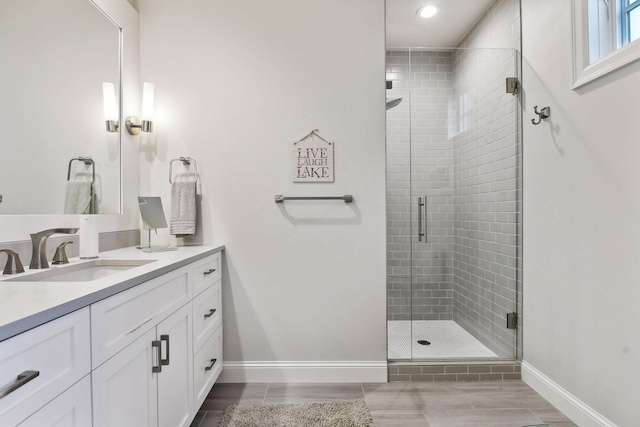 bathroom with vanity and an enclosed shower