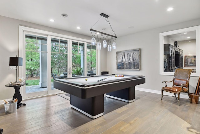 game room with hardwood / wood-style flooring, plenty of natural light, and pool table