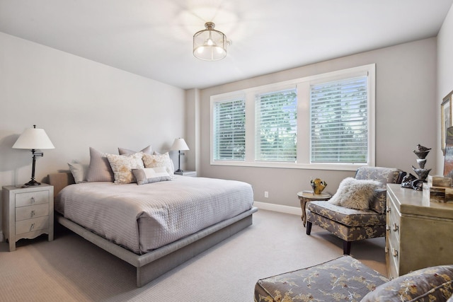 bedroom with light colored carpet