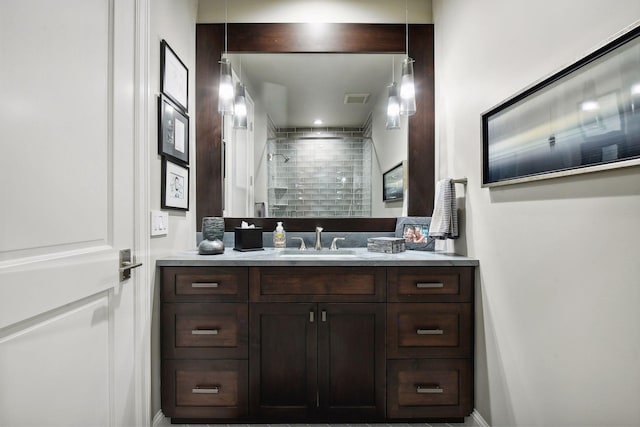 bathroom with vanity and walk in shower