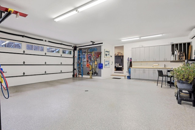 garage featuring a wall unit AC