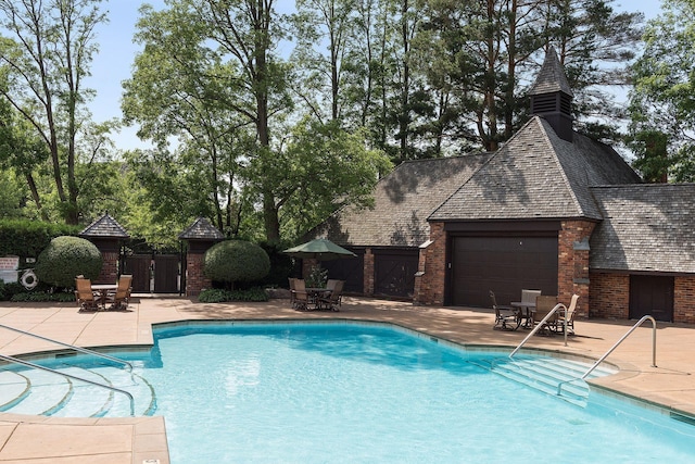 view of pool featuring a patio