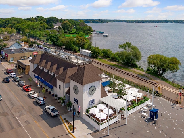 birds eye view of property with a water view