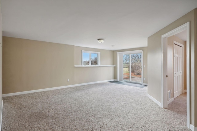 unfurnished room with light colored carpet