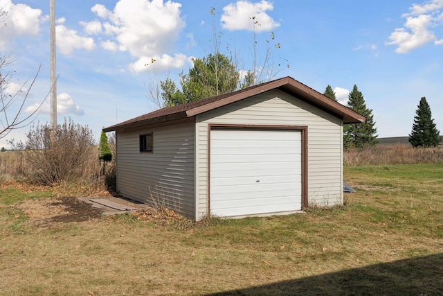 garage featuring a yard