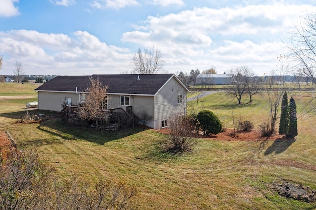 exterior space featuring a rural view and a deck