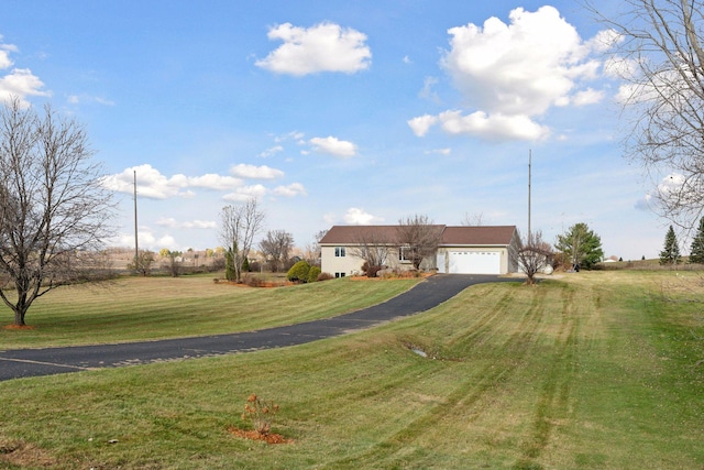 view of front facade featuring a front lawn and a garage