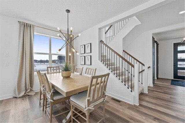 4098 Gable Ln, Woodbury, MN 55129 - dining area with stairway, wood finished floors, visible vents, and a healthy amount of sunlight