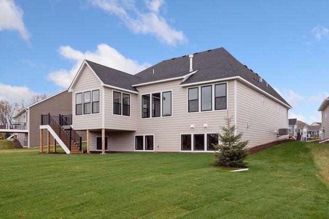 rear view of house with a yard