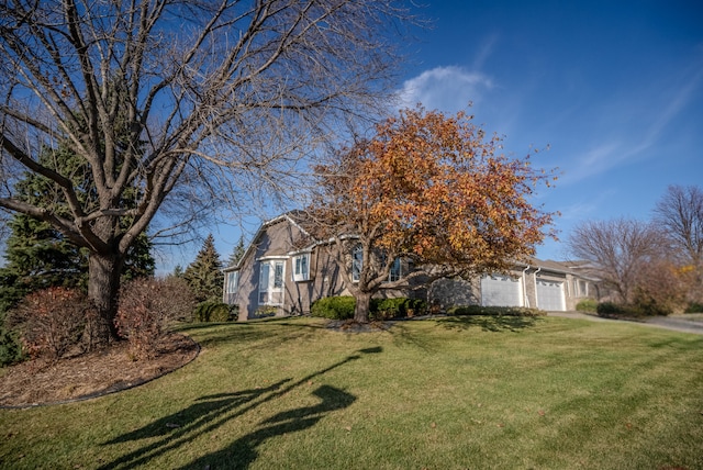 view of front of house with a garage and a front yard