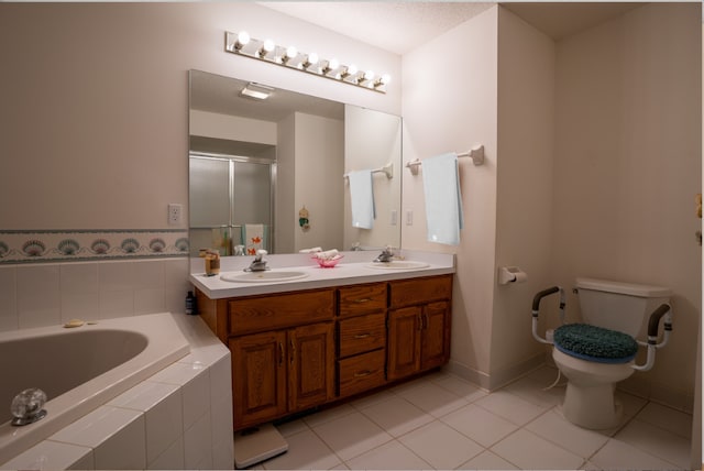 full bathroom with tile patterned flooring, vanity, separate shower and tub, and toilet