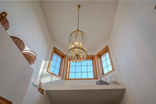 interior details featuring a notable chandelier