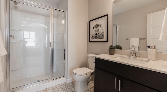 bathroom with vanity, toilet, and an enclosed shower