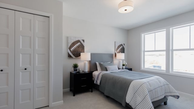 bedroom featuring light colored carpet