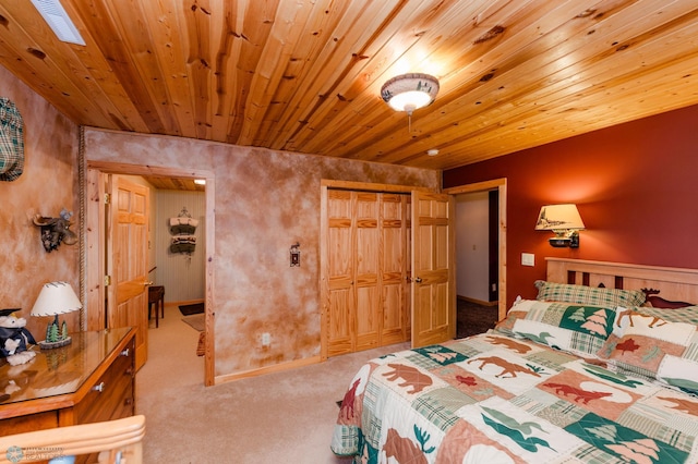 bedroom with wood ceiling, light carpet, and a closet